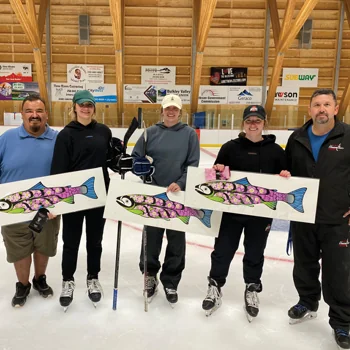 Skaters holding fish drawings